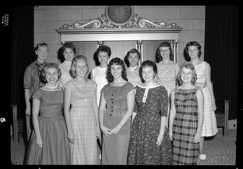 A group of women stand together in two rows for a photo for the Benevolent and Protective Order of Elks Queen Candidates. Front row (Left to Right): Carol Uhlman, Sharon Nonini, Mary Eddins, Darlene Nickerson, Karen Grunrud. Back row (Left to Right): unidentified, Karen Pearson, Sharon Ely, Susan Austin, Peggy Foster, Cathie Russom. All of the women are well dressed and smiling at the camera.