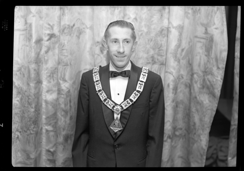 Photo of the Exalted Ruler of the Benevolent and Protective Order of Elks, Bob Wheeler. He is wearing a tuxedo and a pendant.