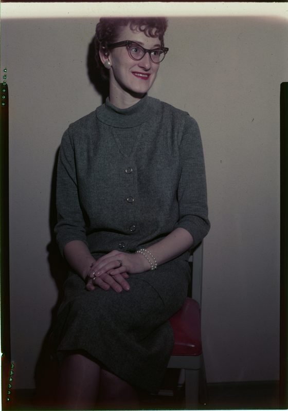 Photo of Dorothy S. Murphy sitting down. She is wearing nice clothes, jewelry, and is looking away from the camera.