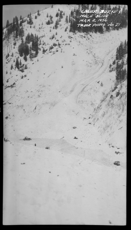 A few snow plows work to clear out the area after an avalanche hit lower Burke and Mace, Idaho. The path of part of the avalanche is visible.