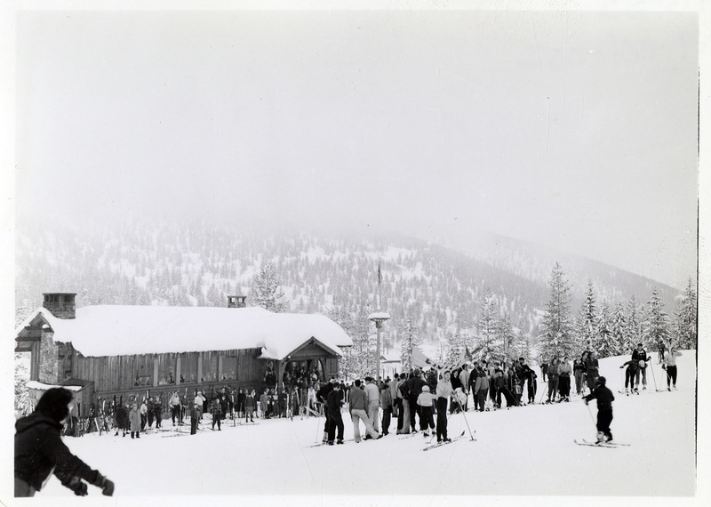 Skiers congregate near one of the buildings at the base of Lookout Pass.