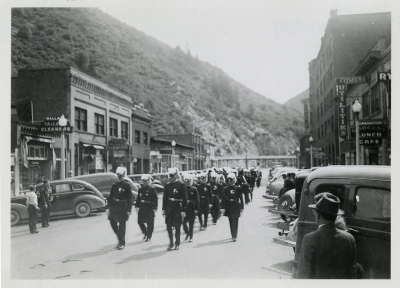 A military marching band proceeds along the parade route for the Benevolent and Protective Order of Elks parade.