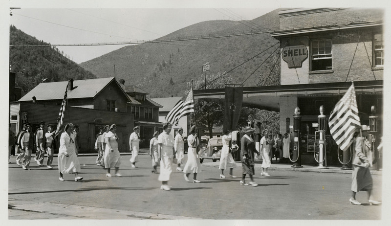 A group of women pass as part of the Memorial Day parade.