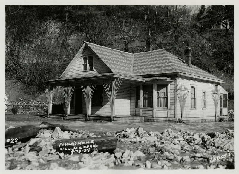 Water encroaches on a house, labeled as "Fahle's Home" by the photograph, during the Wallace flood.