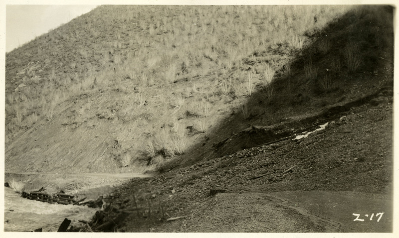 Debris from a landslide covers a road near Wallace.