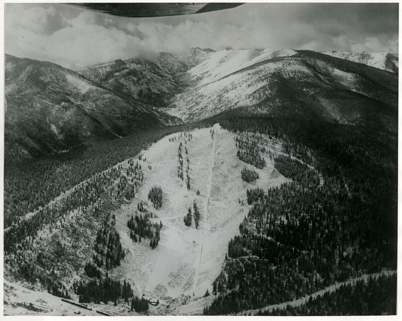 Snow covers the mountainside at Silver Summit, as seen from the air.