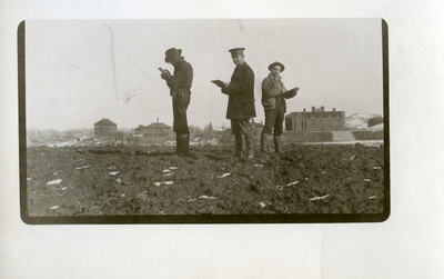 Students with Morrill Hall (Forestry Building) on left and Administration Building on right. Man on left could possibly be Mr. Nichols.