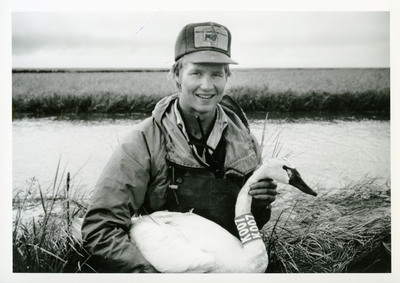 A wildlife student working out in the field for a swan study.