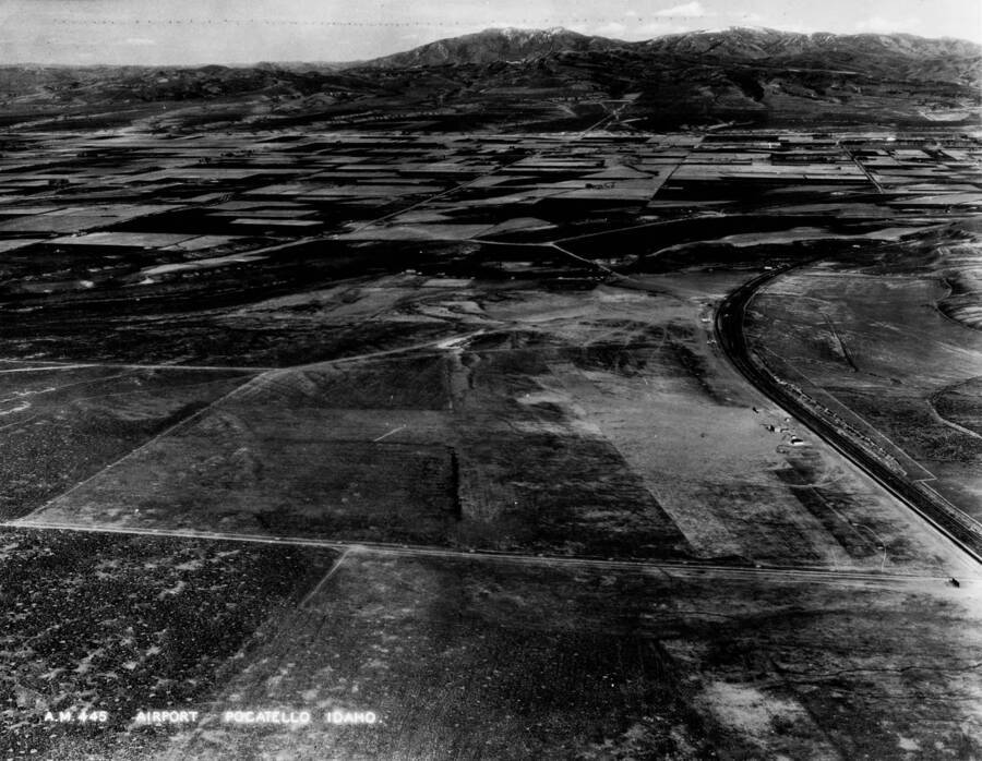 Broad aerial image of McDougall Field also know as Pocatello Municipal Airport site, and surrounding farms and lands.