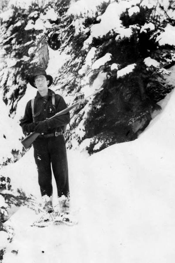 Photo text: 'Jack Godwin, Cooperative Trapper working in the back country, Northern Idaho, 1935.' This image is part of a report by the United States Department of Agriculture Biological Survey on predation and pests.