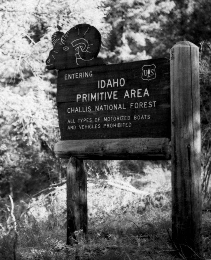 Photo text: 'Signs such as below are posted at all trails to the Primitive Area on Challis National Forest.' Sign reads: 'Entering Idaho Primitive Area -- Challis National Forest -- All types of motorized boats and vehicles prohibited.'