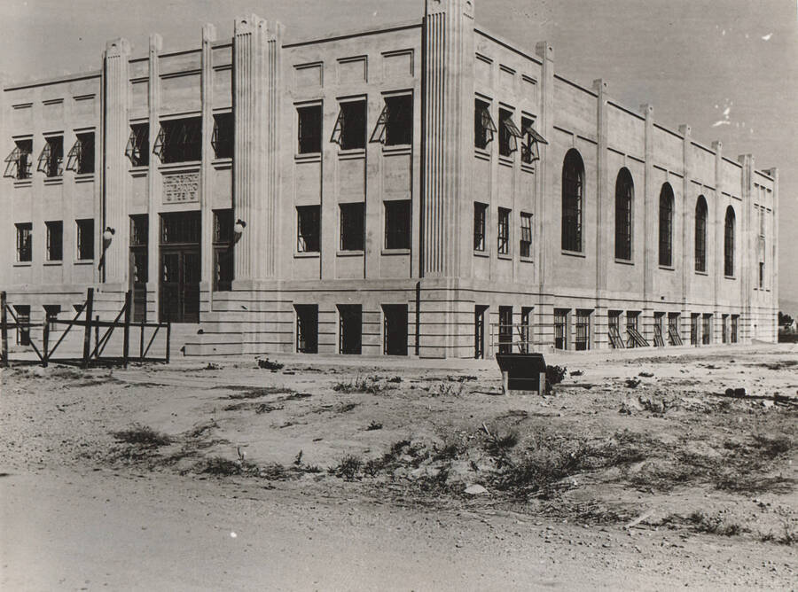 Photo text: 'Gymnasium and Auditorium constructed of solid concrete by WPA workers. Arched west windows and leaded panes allow entrance of light.'  Note: This image is part of a Work Progress Administration publicity series.