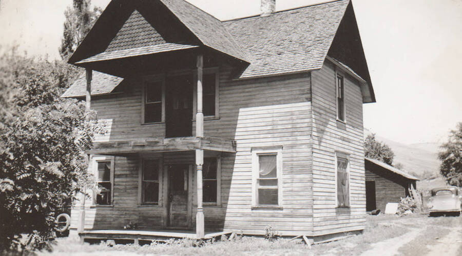 Photo caption: 'This home of Charlie Wilson is to be repaired.' This image is part of a report regarding farm organizations among tribes in Northern Idaho and the CCC-Indian Division.