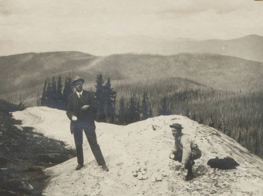 Photo text: 'View of burned timber from Striped Peak July 1911. Palmer and Morris.' This image is part of a pictorial narrative by William W. Morris titled 'Experiences on a National Forest'.