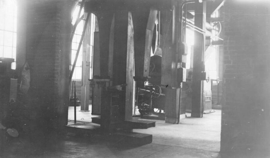 Photo text: 'Interior view of warehouse room, showing in right foreground mixed bait ready to be shipped , and in the immediate background sack storage whole oats.' This image is part of a report by the United States Department of Agriculture Biological Survey on predation and pests.