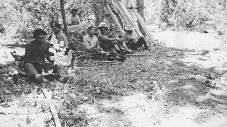 Photo caption: 'After work then it is lunch time.' This image is part of a report regarding farm organizations among tribes in Northern Idaho and the CCC-Indian Division.