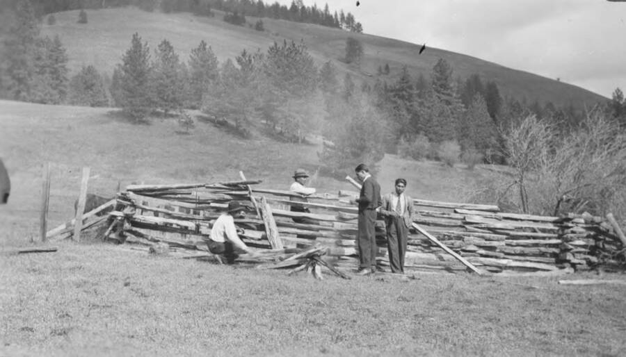 Photo caption: 'Branding corral on the Kamiah Tribal Reserve. Getting the branding iron hot. Waiting for the cattle to come.' This image is part of a report regarding farm organizations among tribes in Northern Idaho and the CCC-Indian Division.