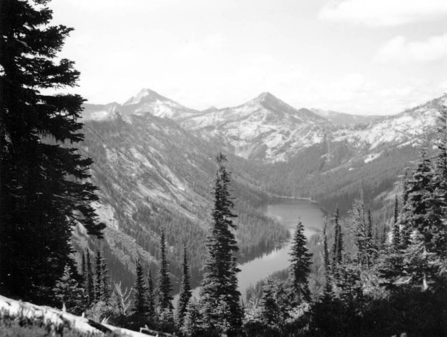 Photo text: 'Big Creek Lake from Stormy Pass on Idaho Divide - Pack Box Pass and Sky Pilot in Back to South - all within Wilderness.' This image is part of a series recording trail work and outdoor education in the Bitterroot National Forest.