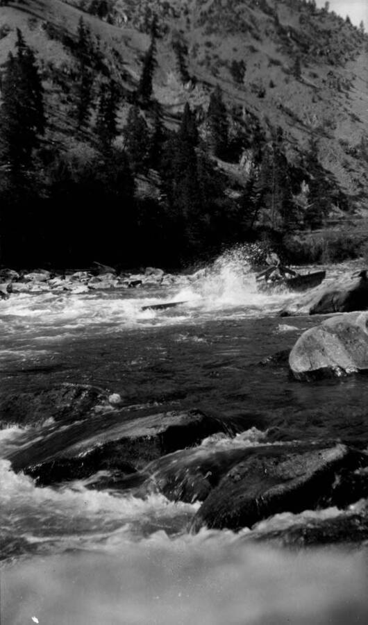 A boat navigating Three Mile Rapids on the Salmon River in the Salmon-Challis National Forest.
