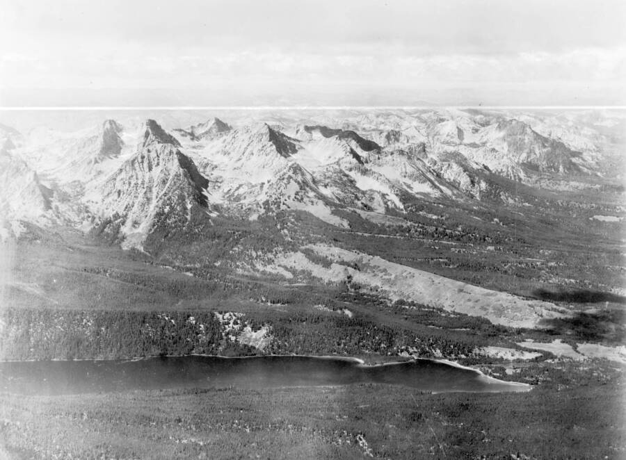 Photo caption: 'Red Fish Lake in foreground. Fishhook Creek is the drainage on other side of Red Fish Lake. Thompson Peak in left foreground between forks of Fishhook Creek. The peak about 1 inch to the right and a little more distant is Mt. Regan. Taken from a point approx. three miles west of Red Fish Lake looking Northwest.'
