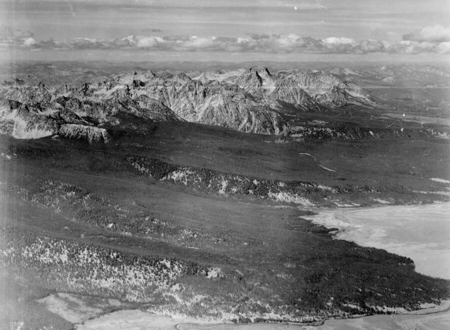 Photo caption: 'Taken approx. over Obsidian Post Office looking Northwest. Peaks shown in photo are Thompson Peak, Baron Peak, Mt. Heyburn.'