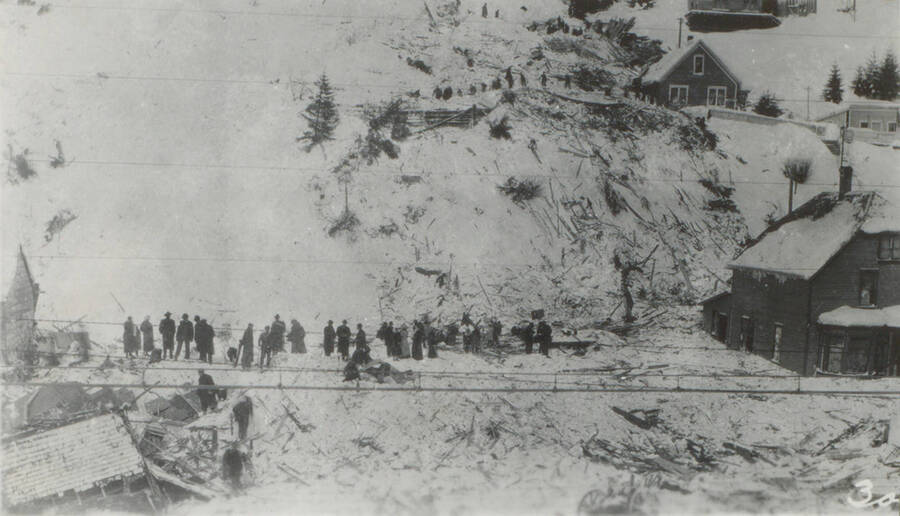 Photo text: 'The slide had gone from the top of Tiger Peak.' This image is part of a pictorial narrative by William W. Morris titled 'Experiences on a National Forest'.