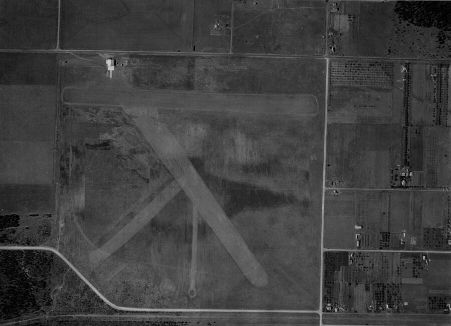 Aerial image of Weeks Field, the first airfield in Coeur d'Alene and, by some sources, the first municipally owned airport in the United States. Closed in the 1940's or 50's it was located on the site of the current Kootenai County Fairgrounds