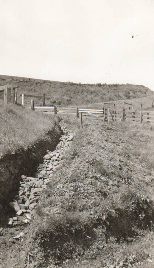 Photo text: 'The start of work on the Barn Creek Soil Erosion Project. May, 1938.' Note: This image is part of a pictorial supplement to a report on the North Idaho Agency and the Civilian Conservation Corps - Indian Division by Sidney L. Johnston, Assoc. Forest Engineer.