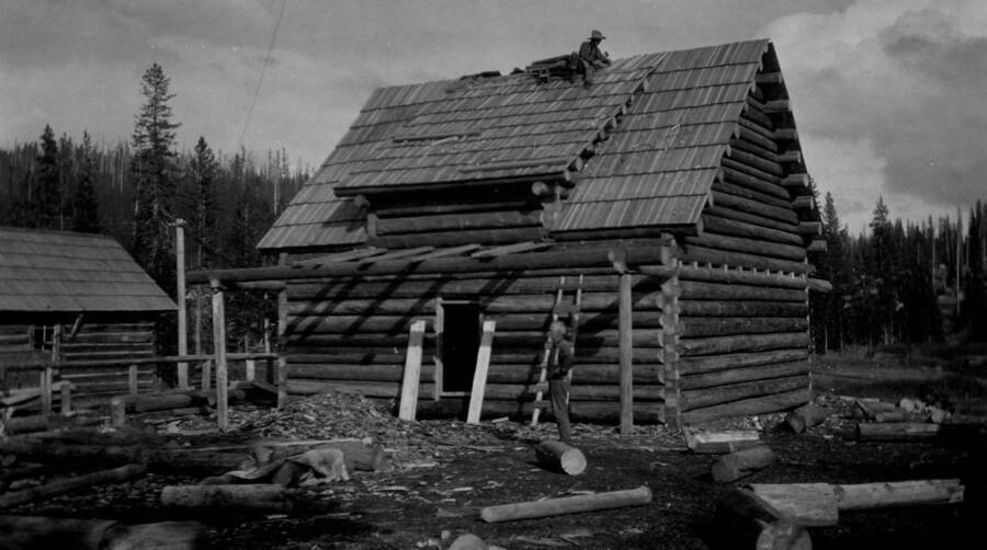 Elk Summit Ranger Station, man shingling on roof
