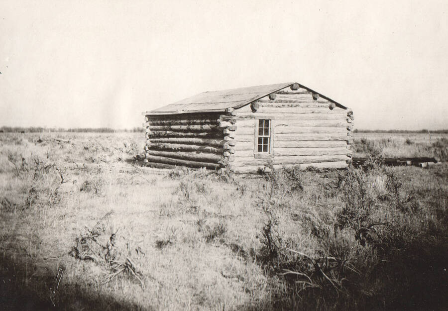 Photo text: 'Log cabin, home of Tom Osborne (Indian), Ft. Hall Indian Reservation.' Note: This image is part of records for Bureau of Reclamation projects.