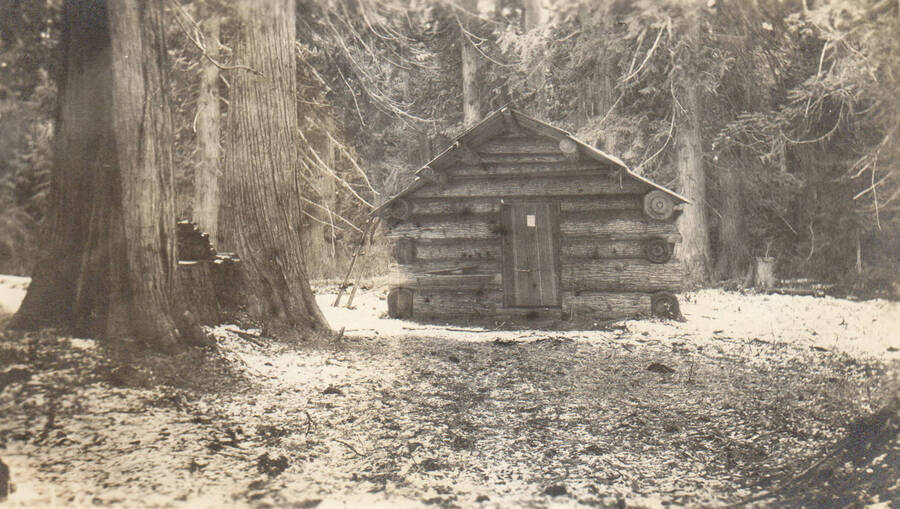 Photo text: 'Cabin on claim of Franklin Theriault, November 6, 1905. Located July 24, 1901. Mr. Theriault was a packer and locater, and held two other claims at this same time. He has since abandoned this one, which was in conflict with scrip owned by Rutledge Timber Company.' Note: Marble Creek region homesteads at this time were often part of a homesteads fraud being documented by the US Forest Service.