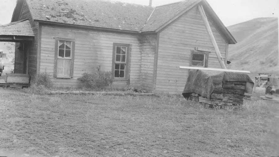 Photo caption: 'Sophia Broncheau of Spalding had a home that needs repairing.' This image is part of a report regarding farm organizations among tribes in Northern Idaho and the CCC-Indian Division.
