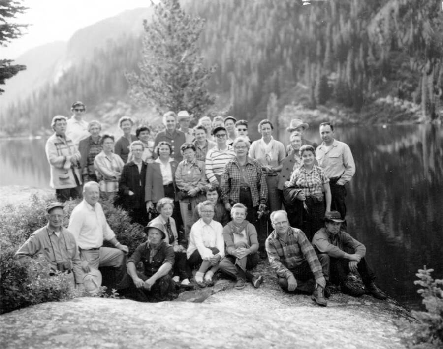 Photo text: 'Teacher pack trip group at Big Creek Lake camp in Selway-Bitterroot Wilderness - 19 states represented , College professors, and school supervisors.' This image is part of a series recording trail work and outdoor education in the Bitterroot National Forest.