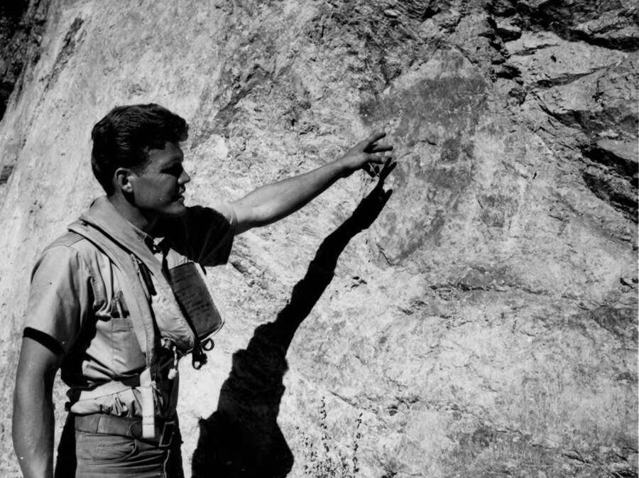 Man points out pictographs near Rattle Snake Campground
