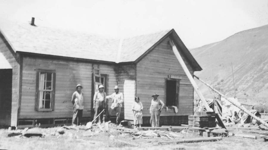 Photo caption: 'The home of Sophia Broncheau is first shingled and leveled.' This image is part of a report regarding farm organizations among tribes in Northern Idaho and the CCC-Indian Division.