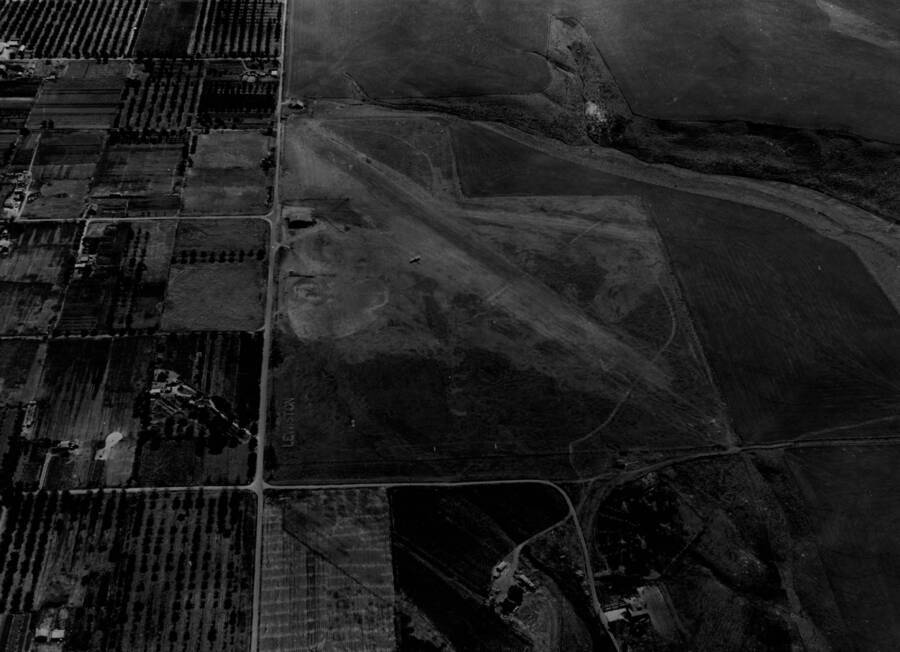Aerial image of rudimentary gravel airstrips as part of the original Lewis-Clark Airport. This site was constructed in 1933. In 1944, on an adjoining plot to the northwest, the current Lewiston-Nez Perce County Regional Airport was constructed.