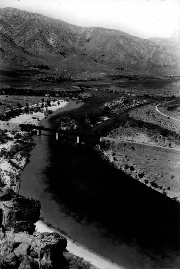 Photo text: 'Boise River at mouth of Moores Creek [current: Mores Creek] showing the large amount of silt carried to the main river by this tributary on which three dredge and numerous placer mines are operating.'