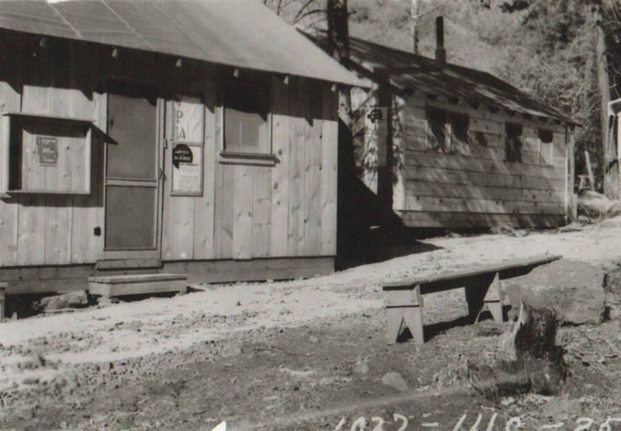 Photo text: 'Cottonwood Camp - Camp and construction scenes on Graves Creek farm-to-market road in Idaho County. Single men's camp.' Note: This image is part of a Work Progress Administration publicity series.