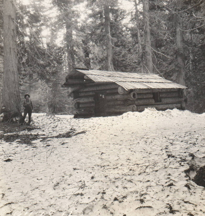 Photo text: 'Cabin on claim of Franklin Theriault, May 31, 1909. Cabin empty and apparently abandoned ar that time. No clearing. Over 5ft. of snow on this claim on that date. He held three claims under squatters rights at the same time.' Note: Marble Creek region homesteads at this time were often part of a homesteads fraud being documented by the US Forest Service.