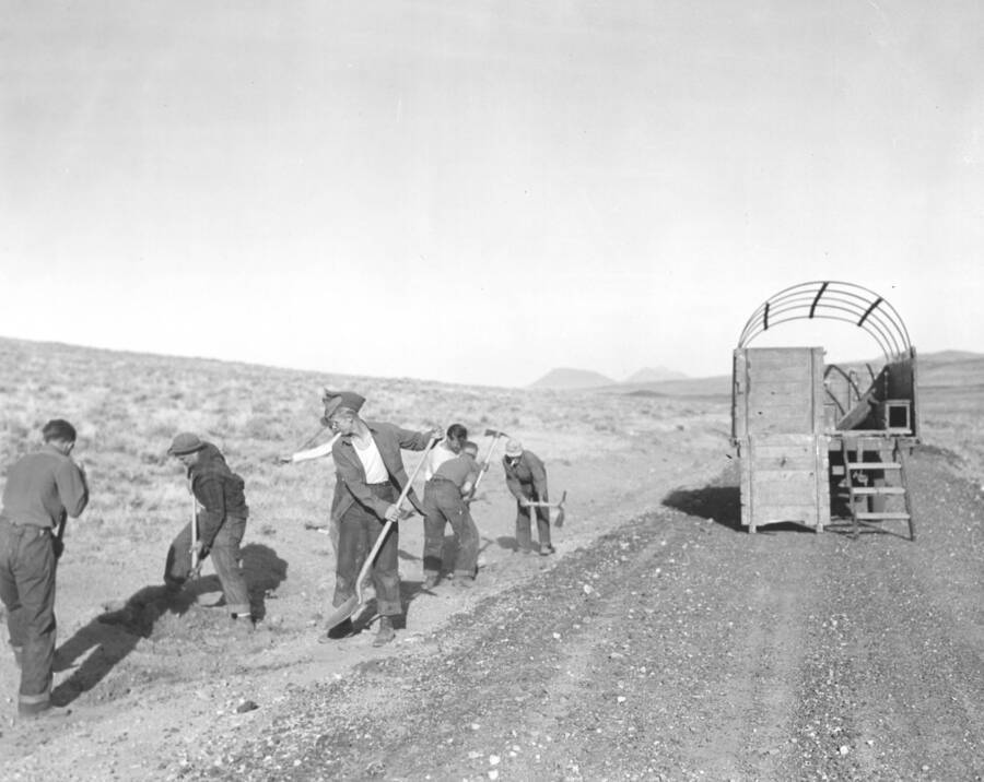 A group of CCC workers from Mountain Home Camp G-99 level at a roadside. Image part of CCC-Idaho Indian Division.