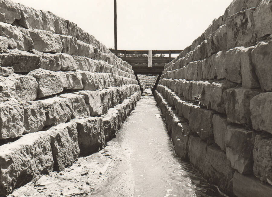 Interior view of rip-rap Sand Creek channel. Note: This image is part of a Work Progress Administration publicity series.