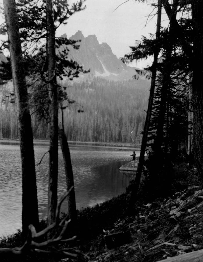 Photo text: 'Lake Mary, on timbered bench above Red Fish Lake. Planted successfully with rainbow and eastern brook trout. Proposed for planting fresh water shrimp.' This image is part of a report by the United States Department of Agriculture Biological Survey and the Wildlife Management Division.