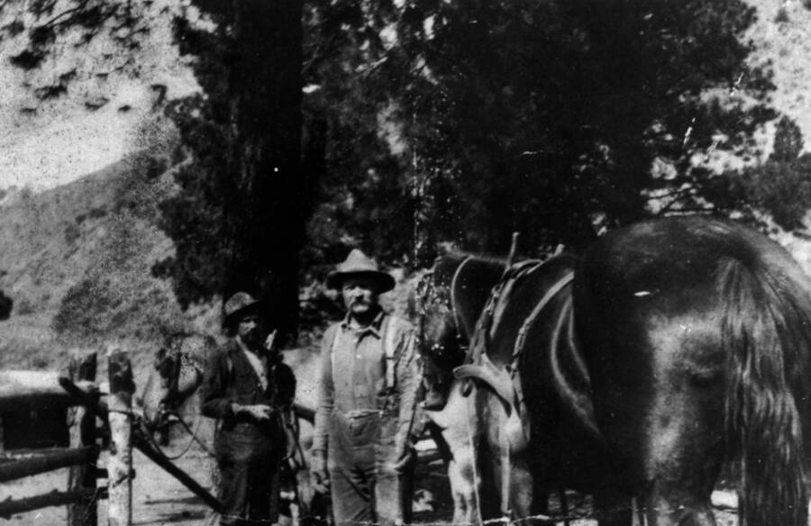 Photo text: 'John H. Slater at Little Creek. Circa 1906-1916. Slater Cabin at left. Photo by Daisy Tappan.'