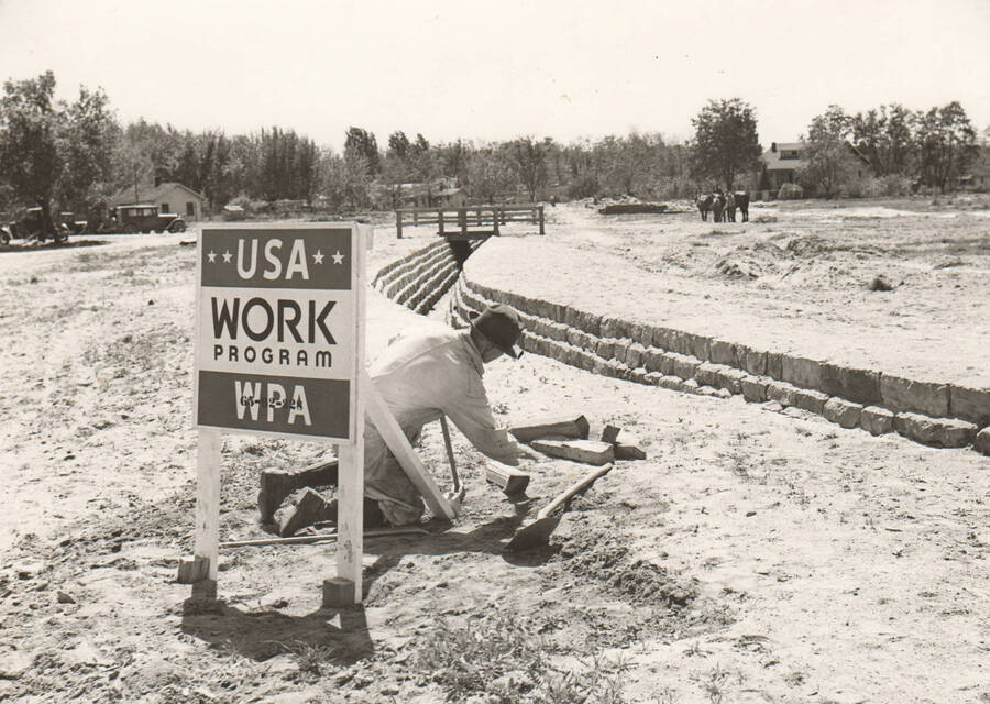 Construction of rip-rap channel to control Sand Creek. Note: This image is part of a Work Progress Administration publicity series.