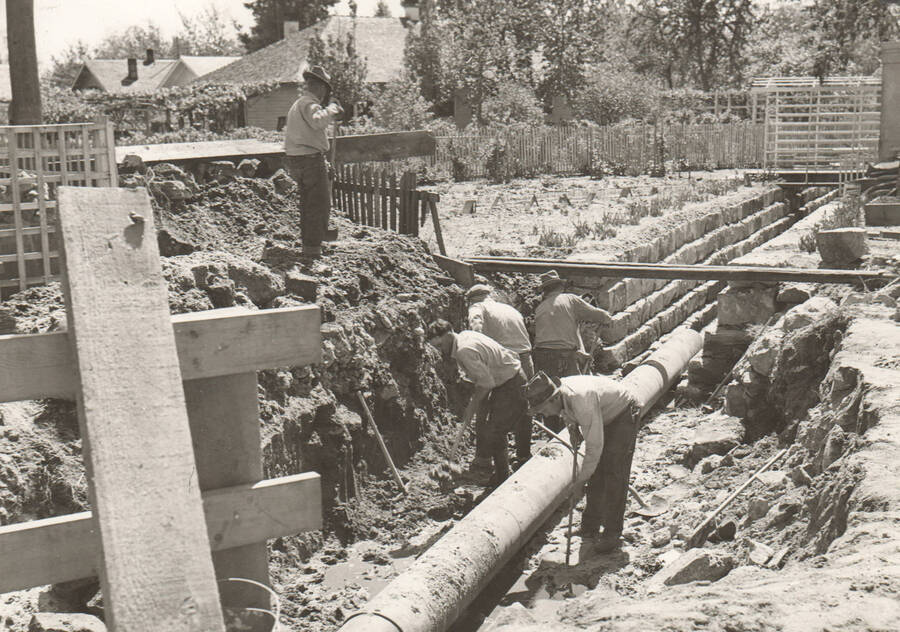 Construction of Sand Creek channel. Note: This image is part of a Work Progress Administration publicity series.
