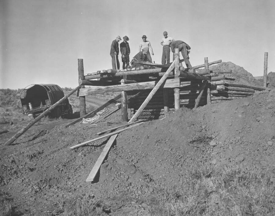 CCC workers from Mountain Home Camp G-99 work together on structure. Image part of CCC-Idaho Indian Division.
