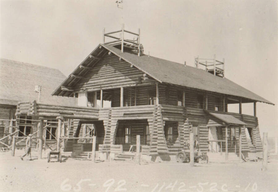 Photo text: 'Idaho Falls Hanger - All log structure at Airport - Idaho.' Note: This image is part of a Work Progress Administration publicity series.