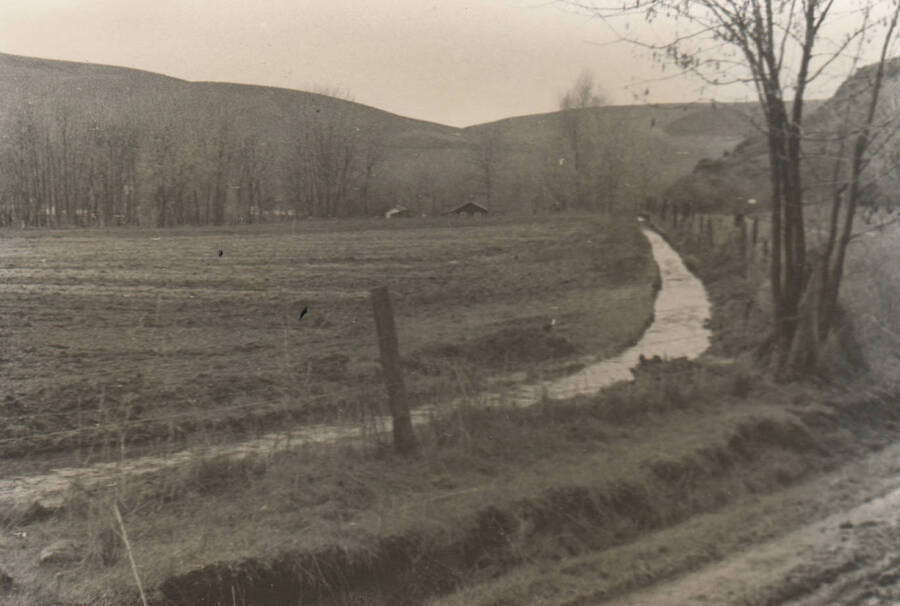 Government irrigation ditch near the Fort Lapwai Sanatorium. Sanatorium is not visible. Note: This image is part of a narrative pictoral report to accompany quarterly enrollee program report.
