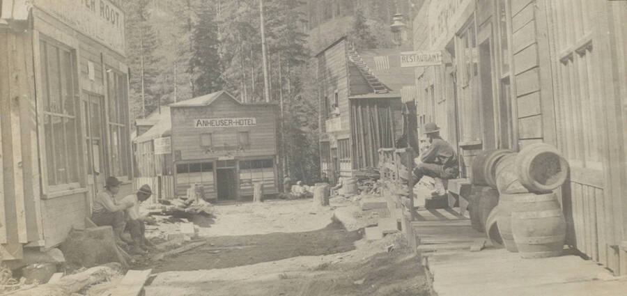 Photo text: 'Grand Forks our 'though' town.' This image is part of a pictorial narrative by William W. Morris titled 'Experiences on a National Forest'.
