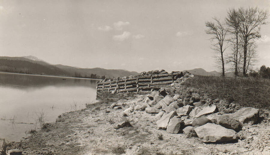 Photo text: 'Rip-rap and Flood Control Project. Completed in 1937. Located along Clark Fork River -- Kalispel Indian Reservation. Picture taken in April, 1938.' Note: This image is part of a pictorial supplement to a report on the North Idaho Agency and the Civilian Conservation Corps - Indian Division by Sidney L. Johnston, Assoc. Forest Engineer.
